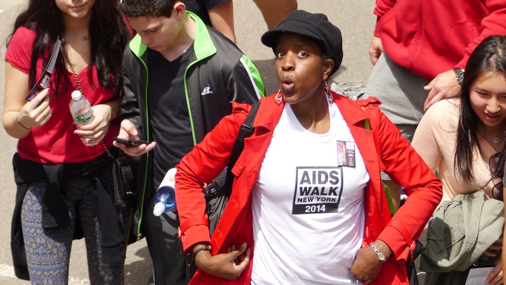 A young woman strikes a pose along the route through the AIDS WALK route in Central Park.